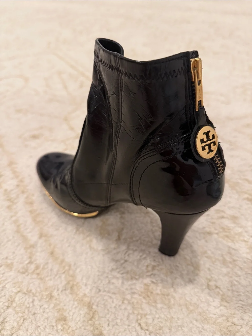 Tory Burch Black Patent Leather Ankle Booties with Gold Emblem